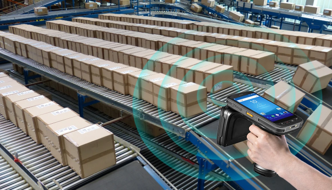 Handheld UHF RFID reader scanning multiple packages in a warehouse