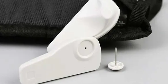 RFID EAS Tag White Anti-theft Buckle with Black Cloth Pouch with a Round Spiked Fastener on the Side