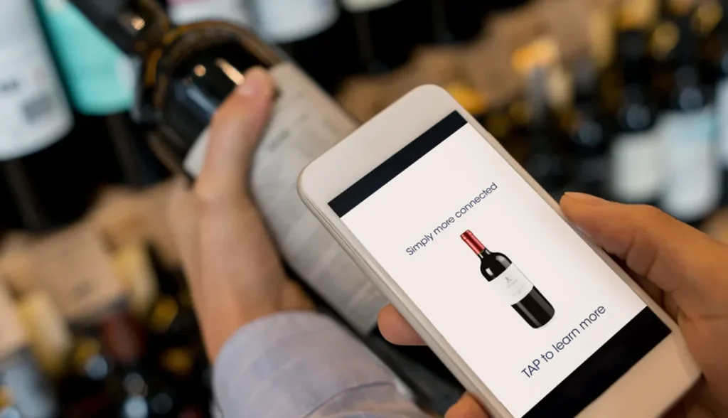 Customer using NFC-enabled phone to tap product label for information.