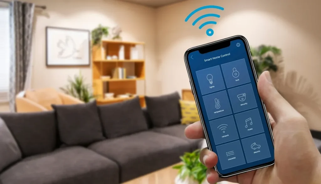 A hand holding a smartphone showing a "Smart Home Control" interface, with a cozy living room in the background and a Wi-Fi signal icon above the phone.