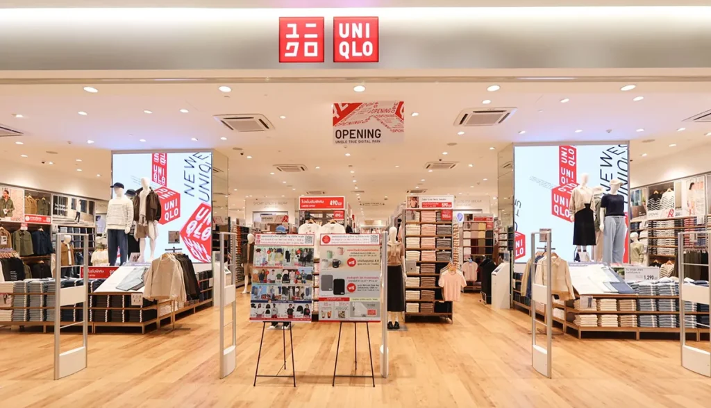 Bright, organized Uniqlo retail store interior with apparel displays.