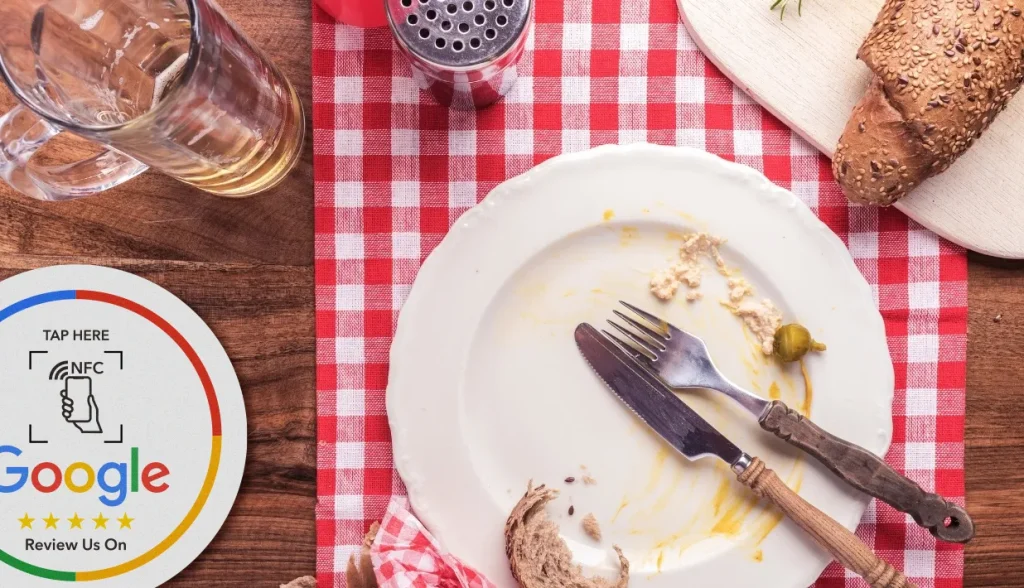 Restaurant table setting with Google review NFC coaster tag for customer feedback collection.