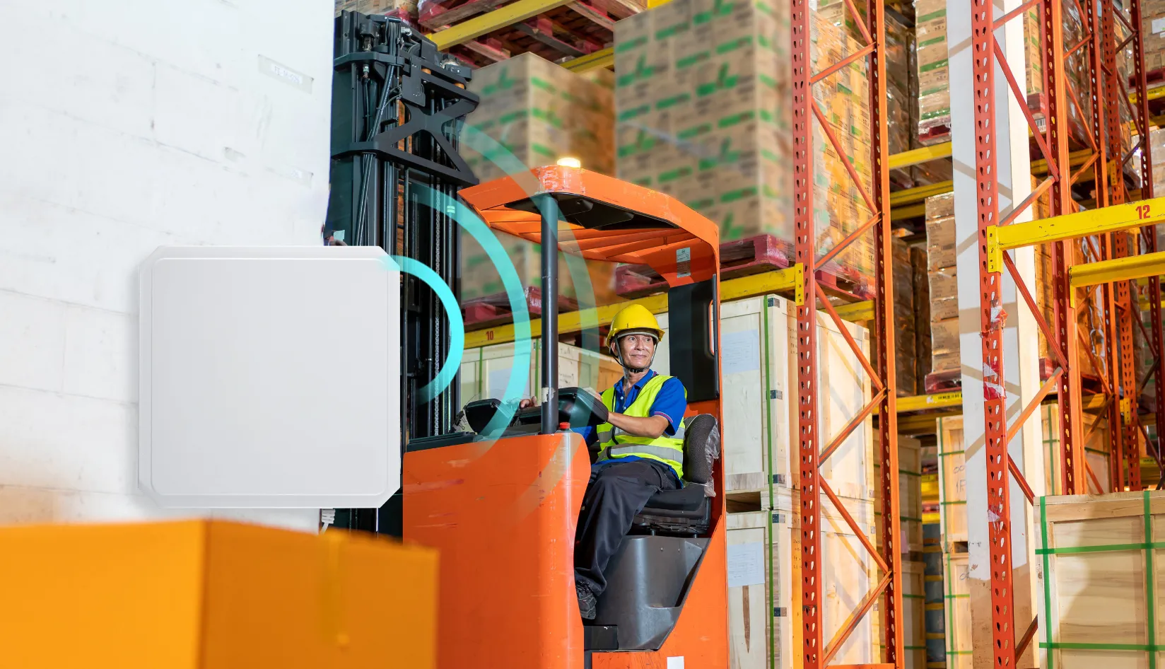 RFID Reader Antenna How It Works and How to Choose the Right One Warehouse forklift truck operating near wall‑mounted UHF RFID reader antenna for inventory tracking inside distribution warehouse.